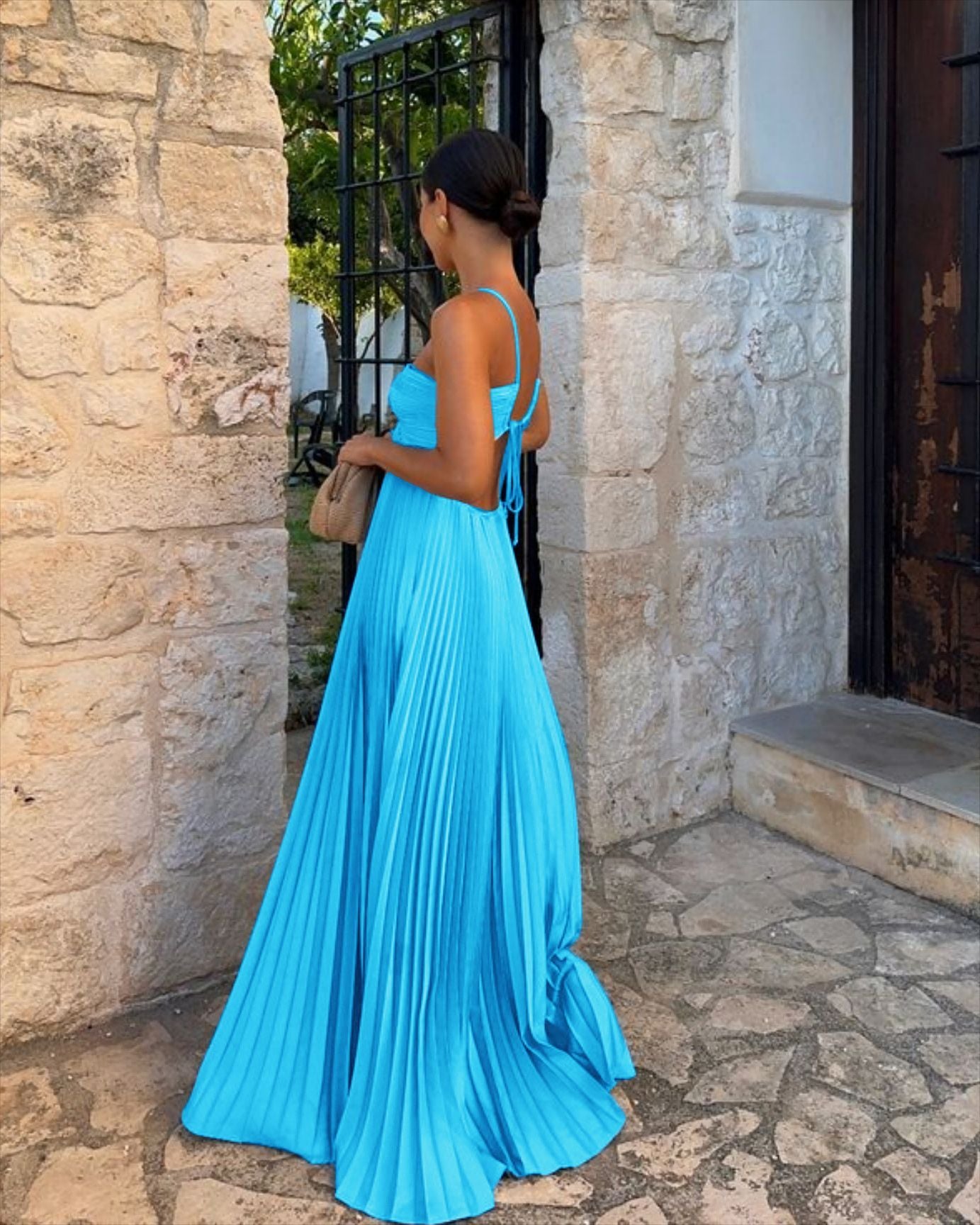 Elegant Long Pleated Dress with Cross Straps – Graceful Flow and Timeless Sophistication