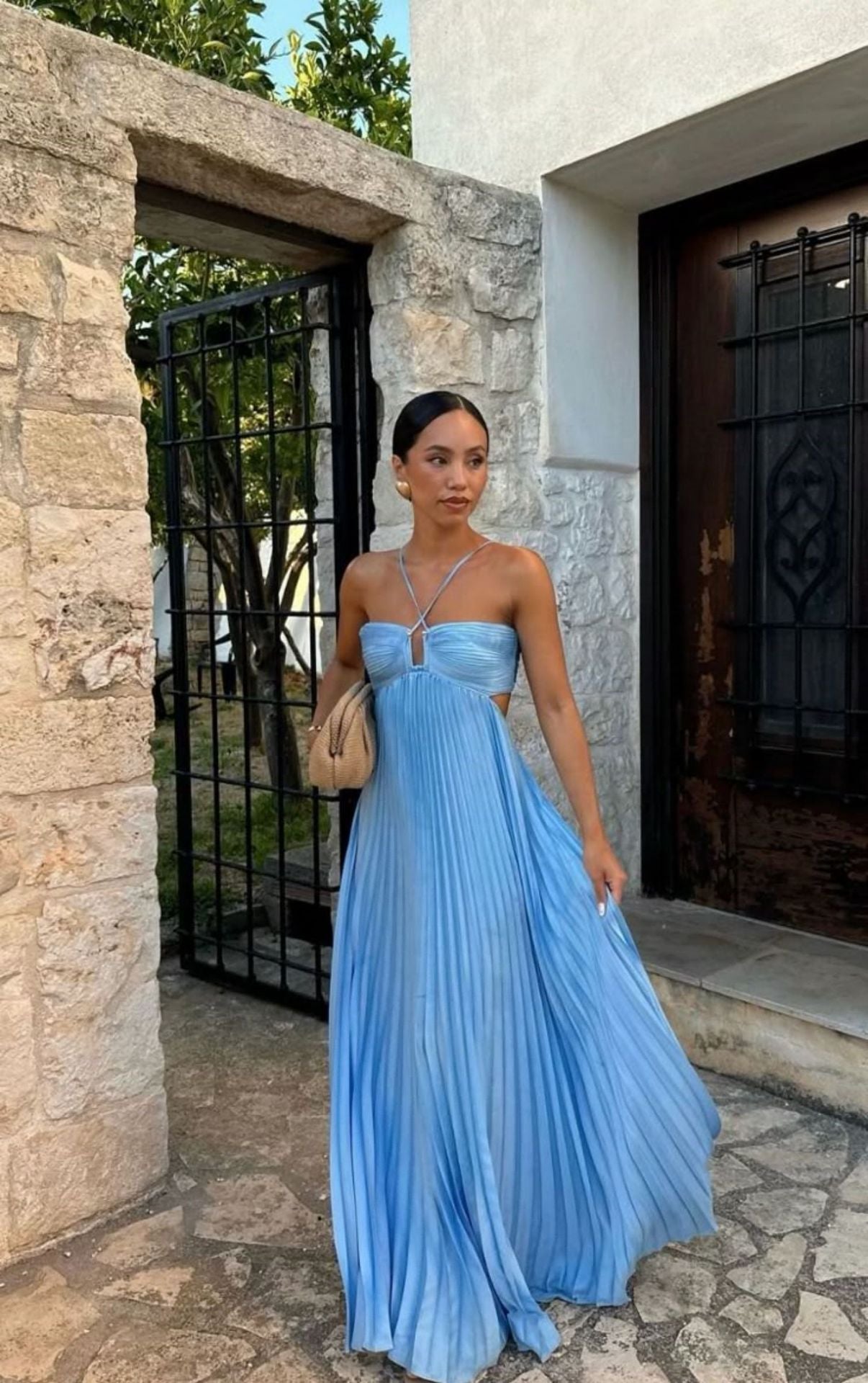 Elegant Long Pleated Dress with Cross Straps – Graceful Flow and Timeless Sophistication