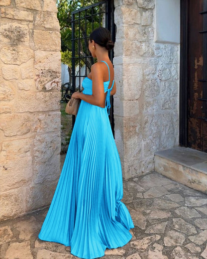 Elegant Long Pleated Dress with Cross Straps – Graceful Flow and Timeless Sophistication